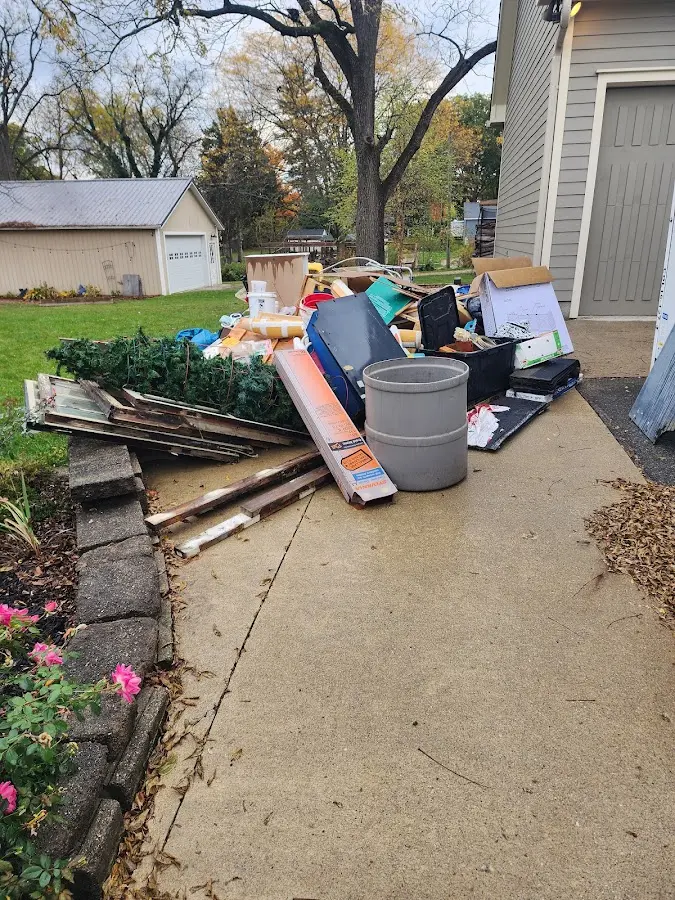 Dumpster being loaded with debris for Residential Dumpster Rental in Sidney
